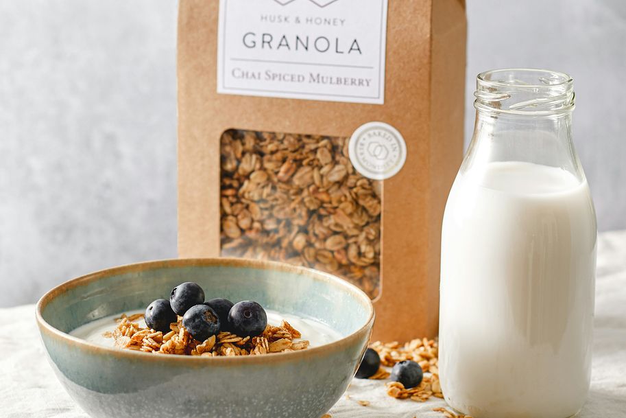 An image of fresh granola and yoghurt with a pint of milk from the partners of Butter & Crust