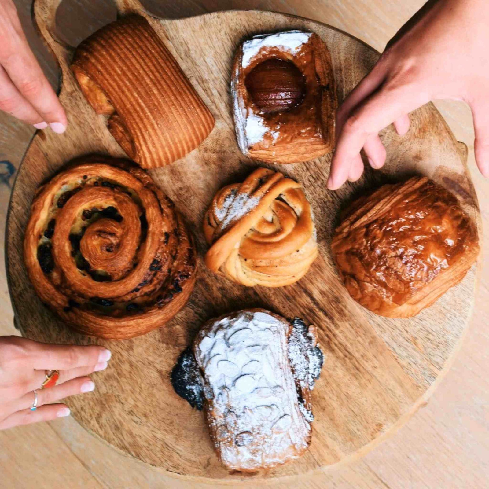 Image of assorted Butter & Crust pastries on a lazy Susan 