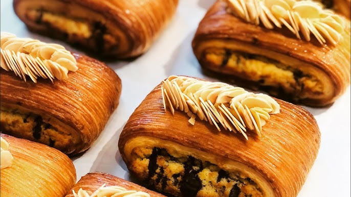 Image of freshly baked pain Suisse on a baking tray